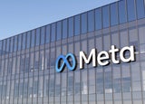A close up shot of a Meta office block with its logo prominently displayed.