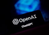 A black card displaying the OpenAI logo with a blue backdrop.