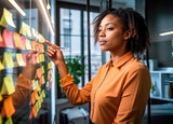 Business owner making notes and revising goals and structure